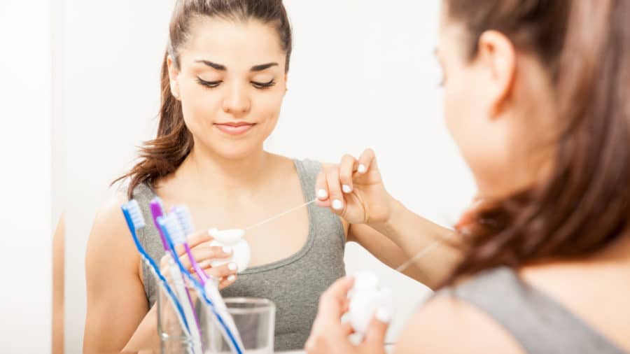 Flossing teeth Washington MI family dentist